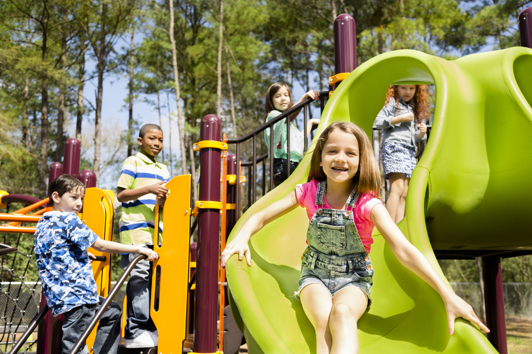 Elementary children play at school recess or park on playground. - WSPTA